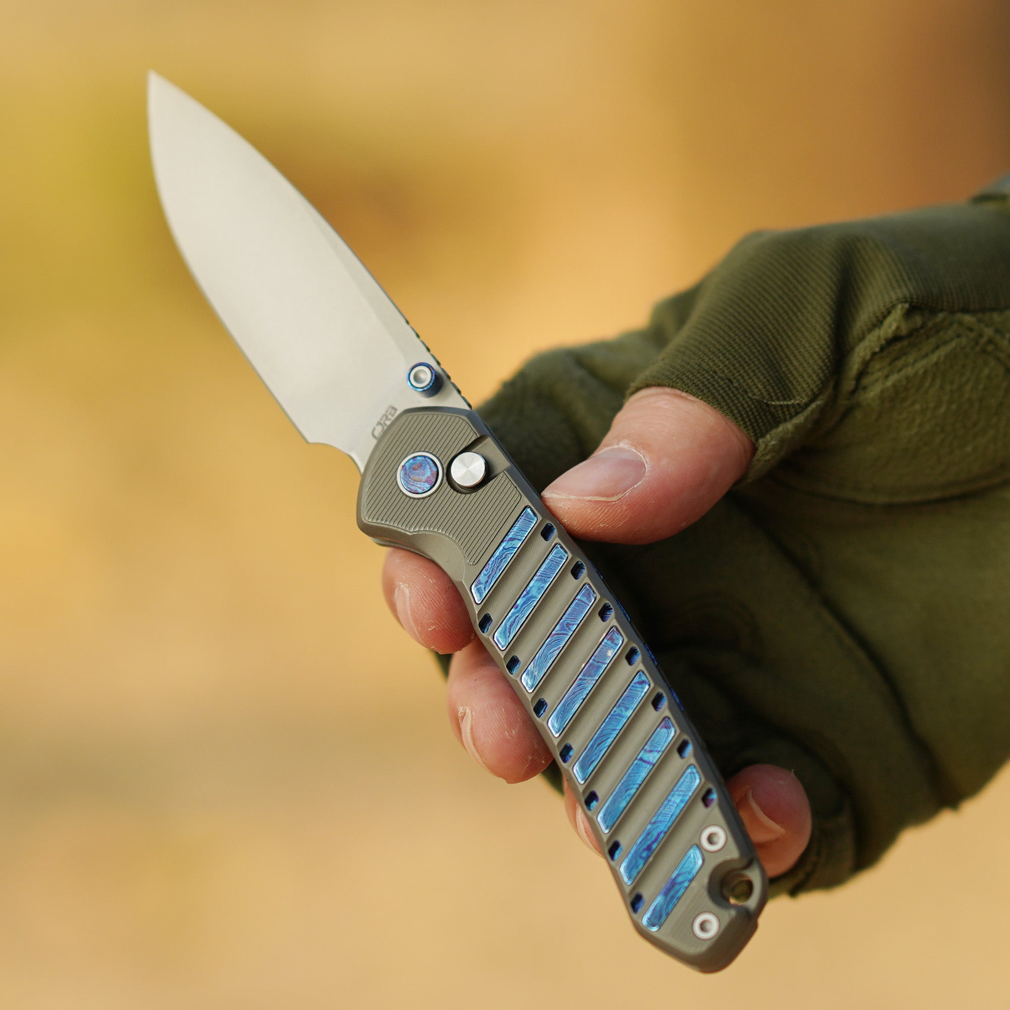 CJRB Galactic Pyrite J1925G folding knife with titanium handle with titanium Damascus inlay